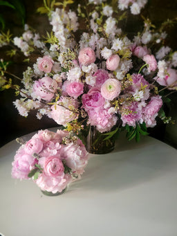 Arrangement with cherry blossoms peonies roses and pink hydrangea