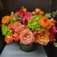 Arrangement with green hydrangea , garden roses , spray roses , ranunculus eucalyptus and hellebore.