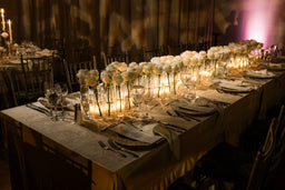 Bud vases with white roses