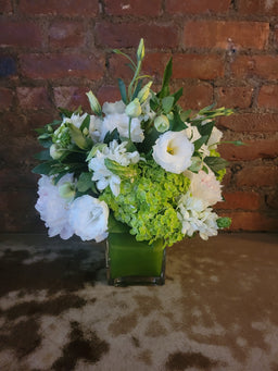 Arrangement with white and green hydrangea lisianthus roses